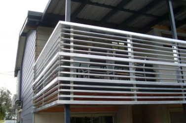 Metal rails on the edge of an outdoor house deck - metal fabrication gold coast